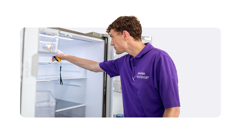 In-home service appliance+ tech checking fridge