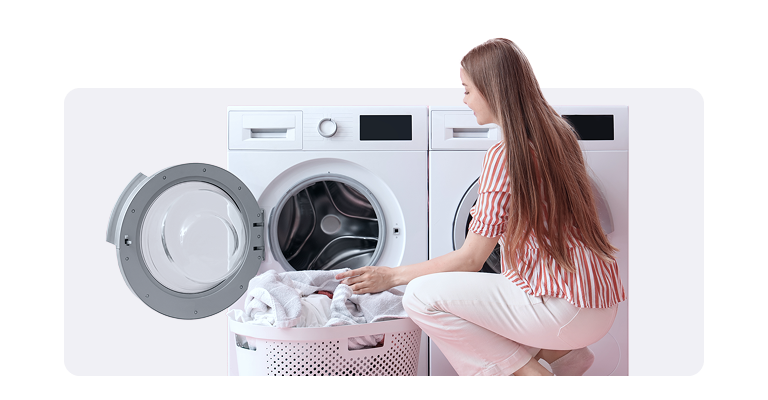 Reliable repairs appliance+ woman taking out laundry from dryer