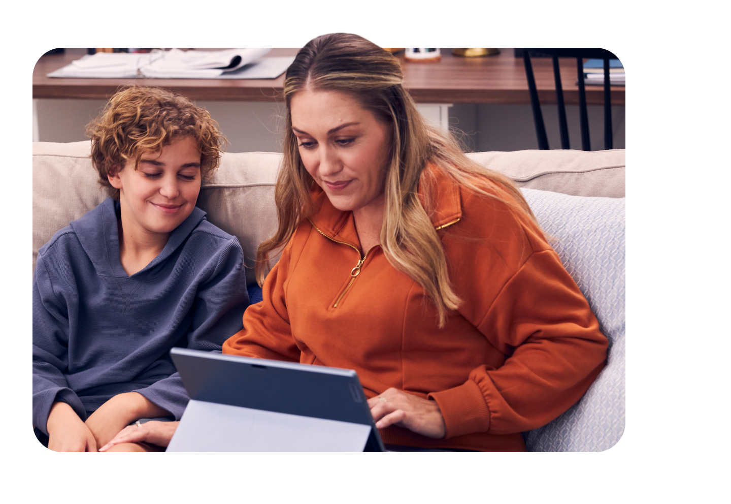 Woman using a tablet on a couch